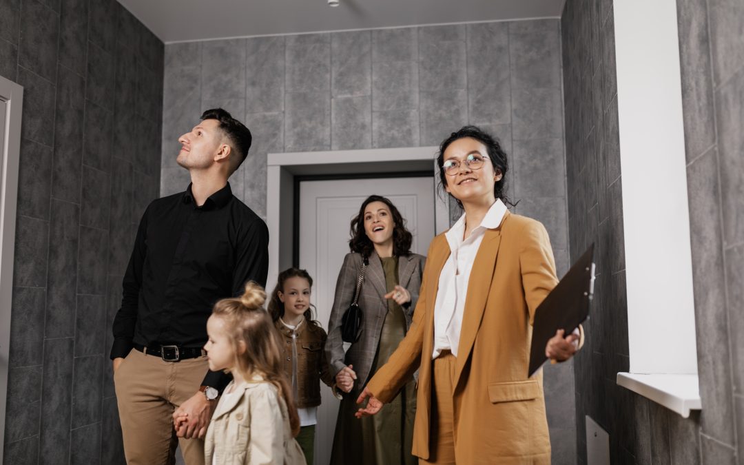 Family in a house with realtor